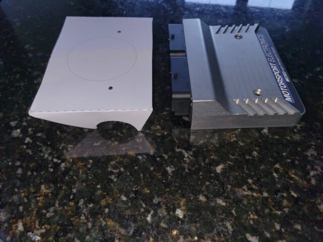 Busy messing around with paper templates before even trying cardboard! 

These will be brackets for mounting the Motorsport Electronics ECU and Hardware PDM to a cage dash bar. They'll be done in mild steel and welded to the bar. I'll get them cut elsewhere as they are too big for my machine.