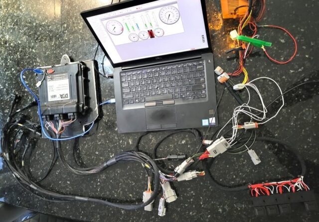 It might look chaotic but it all works :-)

I've just bench tested the DTAFast T12 ECU with bespoke engine and chassis harnesses. Everything was spot on although I did have a small wobble with the fan relay not turning off - then I realised that without a coolant sensor in place, the ECU assumes a high engine temperature (above the threshold for the fan). A little bit of juggling in the software and all was good.

Next job is to fit this to the car and build the gearbox and paddle shift wiring.